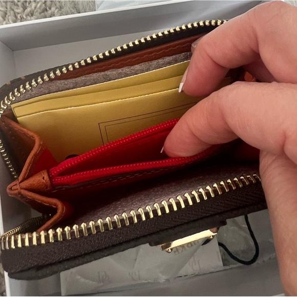 The Dooney & Bourke Greta Large Zip Around Credit Card Case - Picture 3 of 14